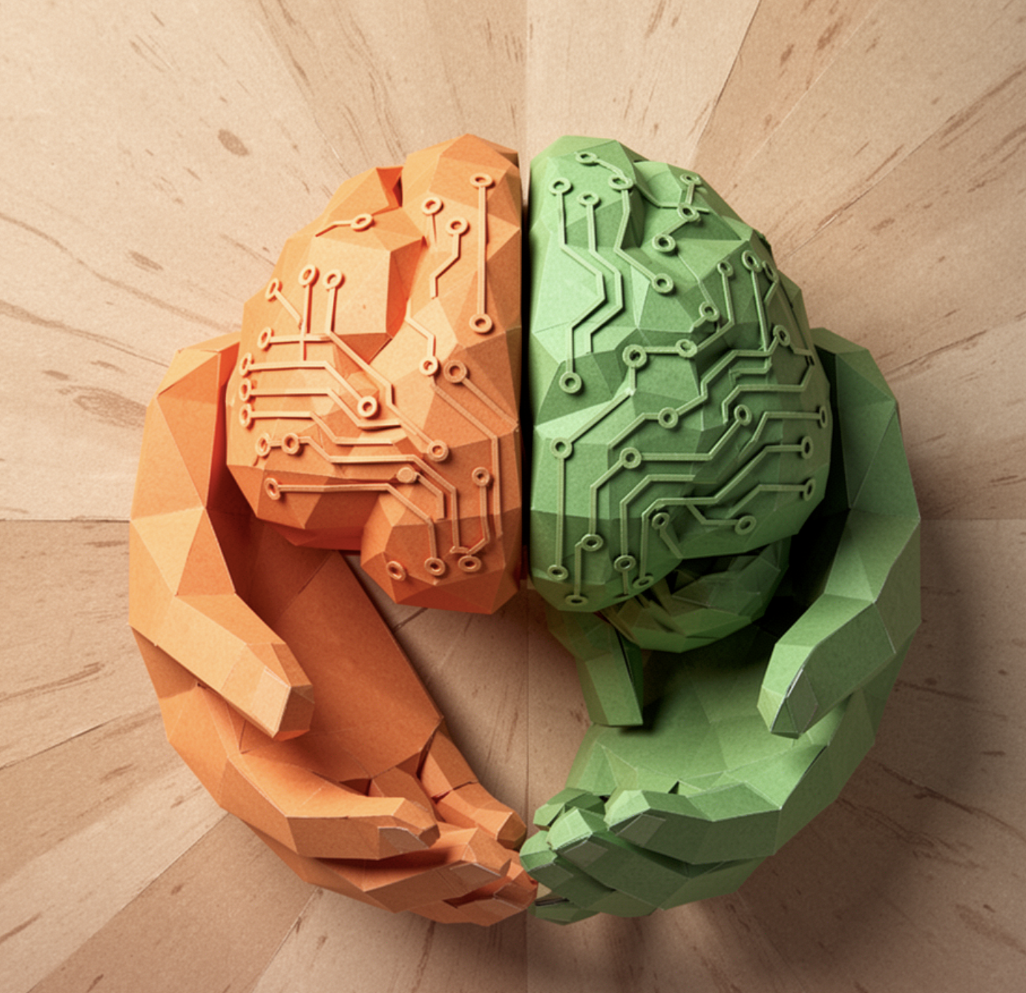 Paper-cut illustration of a dual orange and green brain with circuit patterns representing the intersection of AI engineering and human-centered design